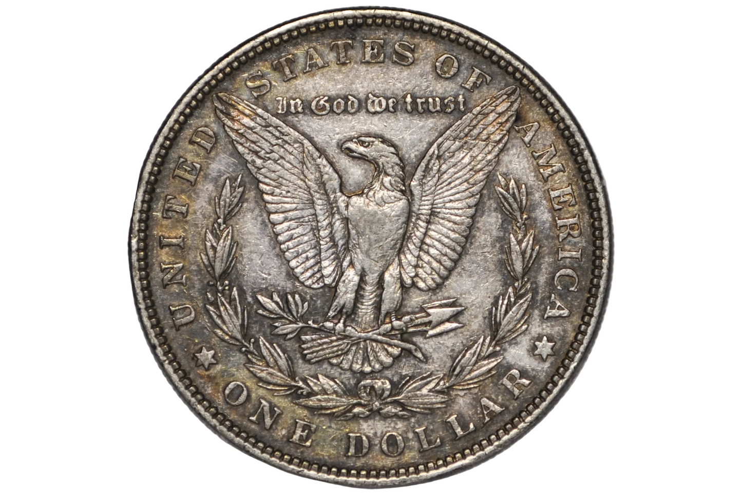 A vintage United States one dollar silver coin featuring the eagle design, displayed inside a clear plastic protective capsule against a neutral gray background.