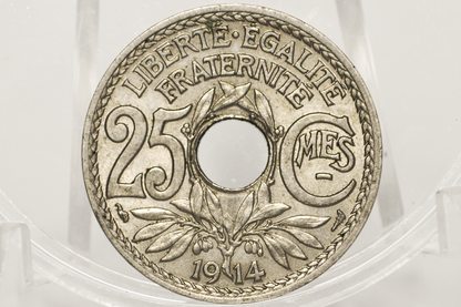 A silver-colored 25 cent coin from 1914 featuring the words 'LIBERTÉ ÉGALITÉ FRATERNITÉ' and a central hole, displayed inside a clear plastic holder.