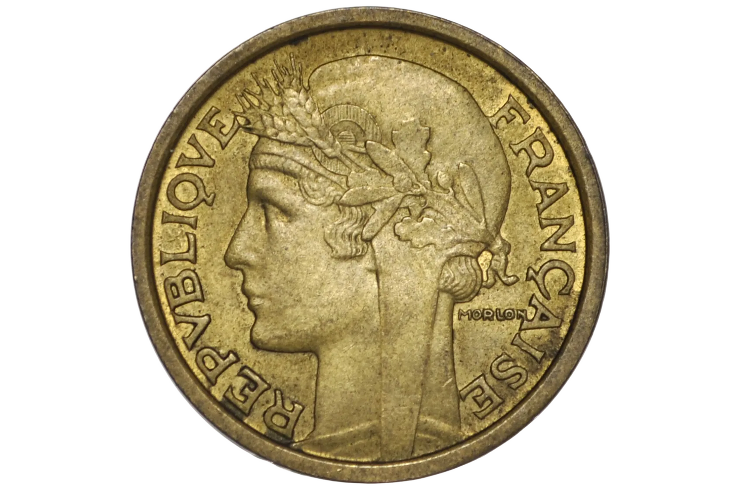 A French Republic 1 Franc coin with a golden-bronze frosty finish, encapsulated in a clear plastic protective holder against a white background.