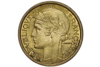 A French Republic 1 Franc coin with a golden-bronze frosty finish, encapsulated in a clear plastic protective holder against a white background.