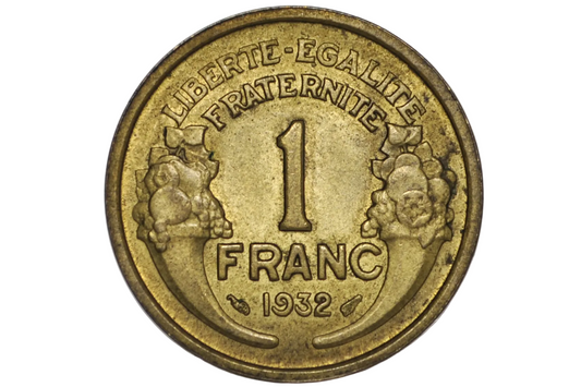 A vintage 1932 French 1 Franc coin with original luster inside a clear plastic protective capsule, showing the 'Liberte-Egalite-Fraternelle' design with two cherubs and the denomination '1 FRANC' in raised lettering.