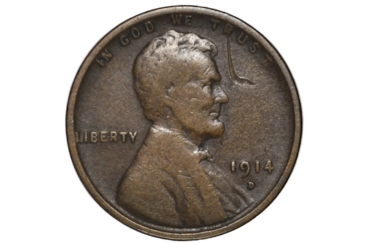 A 1914 D US penny coin showing the Abraham Lincoln profile with 'IN GOD WE TRUST' and 'LIBERTY' inscriptions.